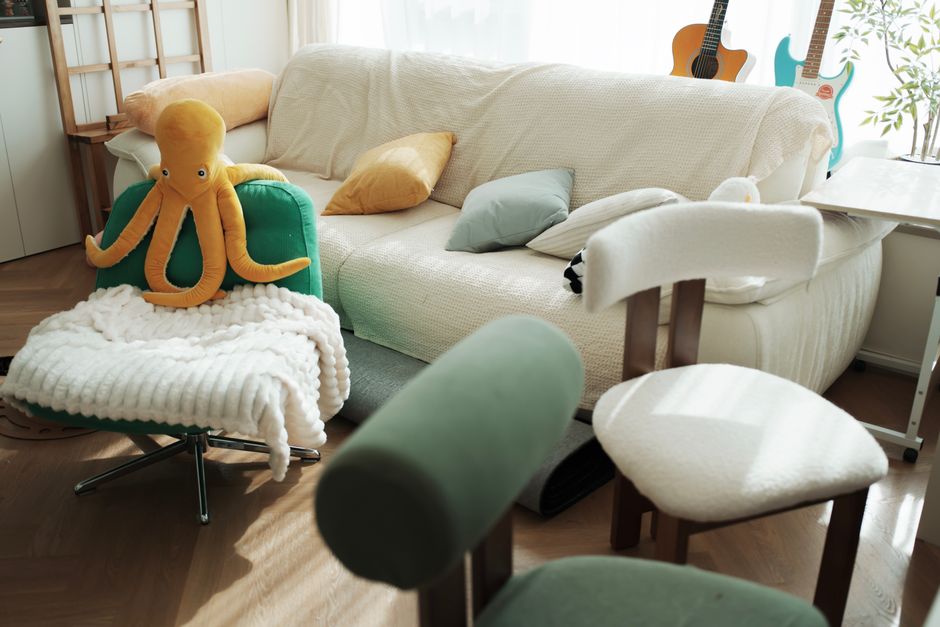 Brightly lit living room with plush decor and vibrant colors, warm and inviting.